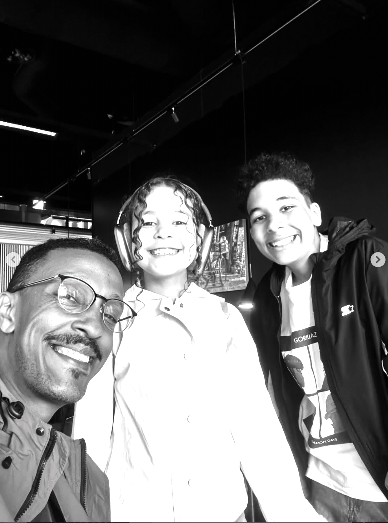 Three people smiling together