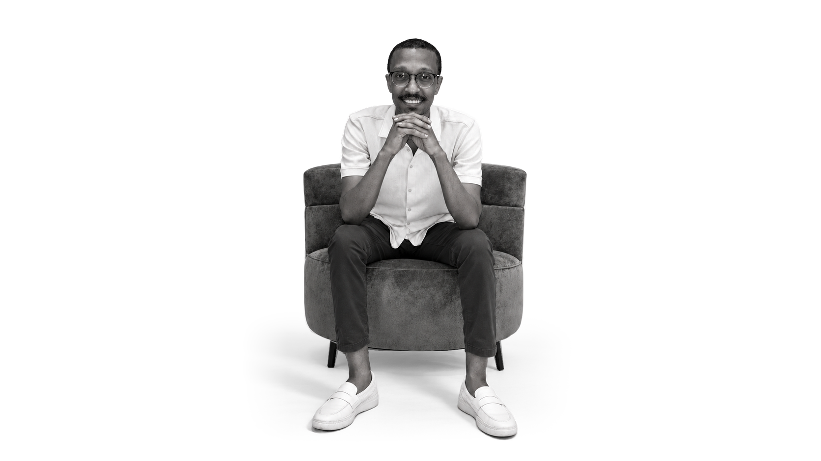 Salah seated in his chair, photographed in black and white